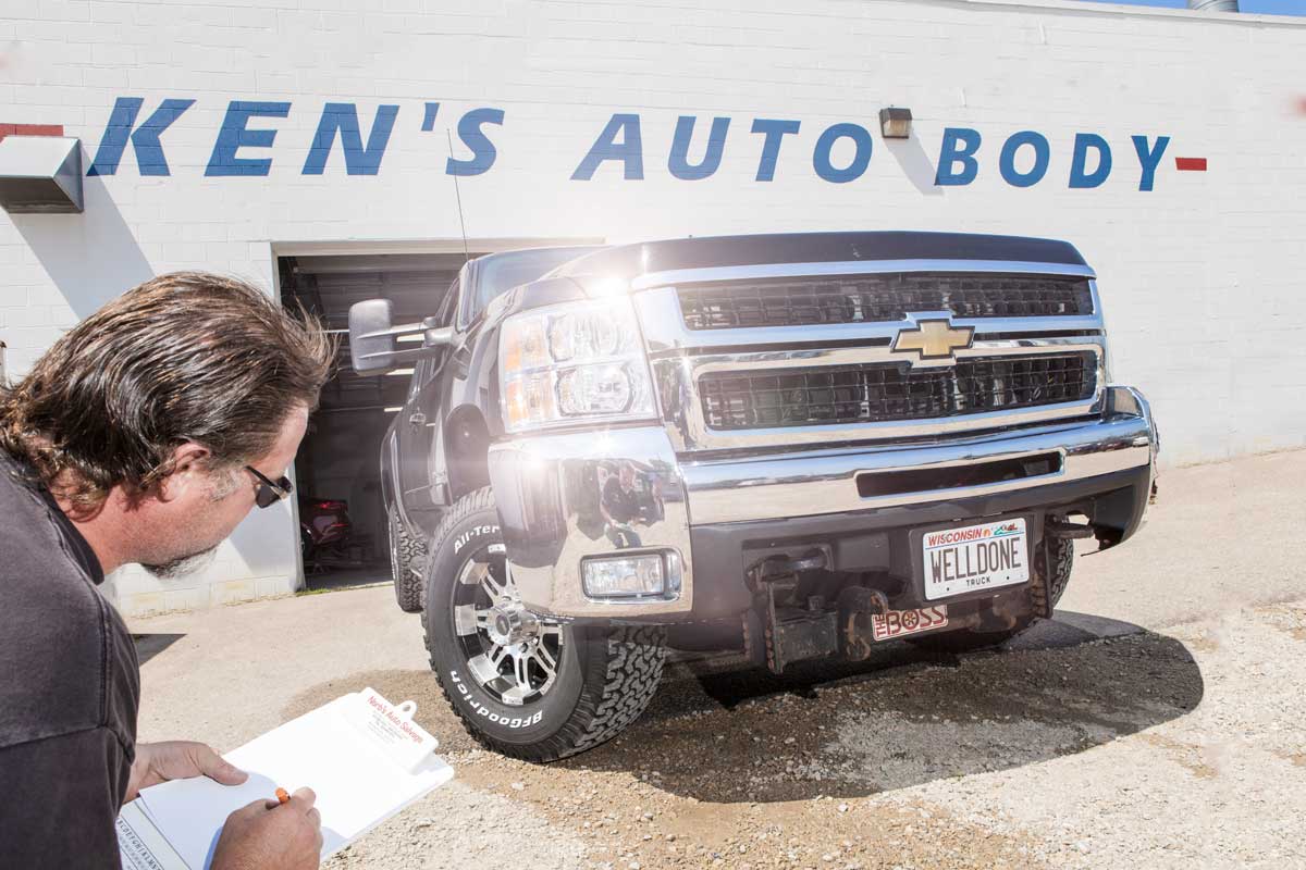 Man Inspecting Truck